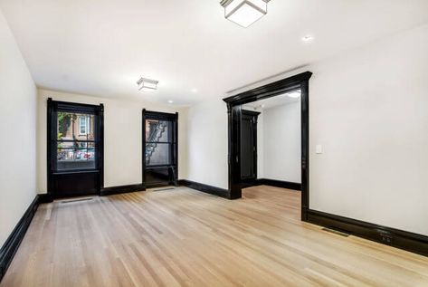 Black Trim Light Floors, Black Wall Trim Interior, Black Painted Moldings And Trim, Interior Black Trim And Doors, Black Trim Baseboards, White Walls Black Molding, Black Woodwork Trim Interior Design, White Bedroom Black Trim, Black Skirting Boards Living Room