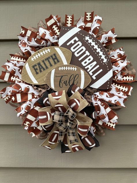 Welcome your friends and family with a Fall/Football Wreath!!  Perfect for a mancave, over your fireplace, den, hang it on your wall or on your front door. The ribbon is a combination of 5 different wired ribbons, Football Sign and Mesh.  Your Wreath will be shipped in a large box, safely secured to the box. Keep the box for easy storage! If the wreath is placed outside, be sure to secure the wreath tightly so that the wind doesn't blow it away. Make sure to have coverage, a covered porch would work best!  It also fits perfectly between most screen and storm door or on your deck to add some summer fun! Remember to fluff your bows when taken out of box. "Favorite My Shop" so you can view all my upcoming projects for all holidays, different seasons and a huge variety of Themes. Unfortunately Nfl Door Wreath, Football Wreaths For Front Door Diy, Football Season Wreaths, Football Porch Decor, Wreaths With Mesh Ribbon, Football Wreaths For Front Door, Diy Door Wreaths, Football Wreath Diy, Fall Football Wreath