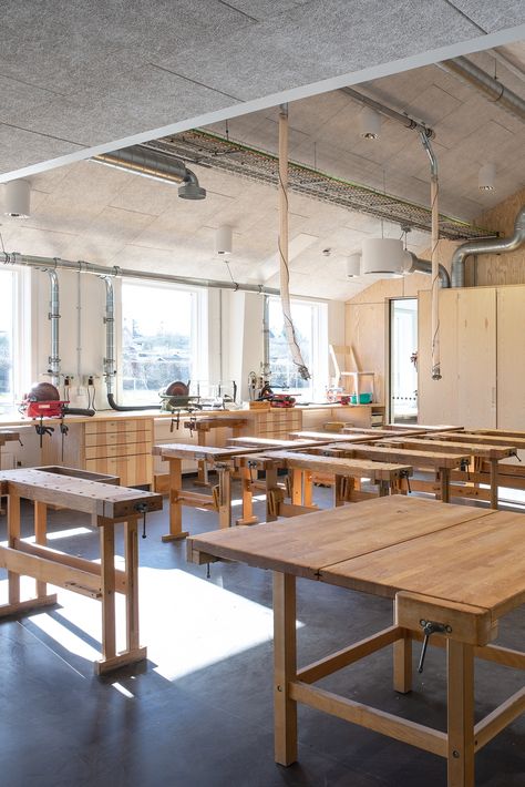 The cultural centre features black Troldtekt line ceilings and stone floors – robust, textural surfaces that perfectly complement the existing brick walls and wooden structures. In the corridor and all the classrooms, white Troldtekt ceilings have been installed to create a better indoor climate. #goodacoustics #holzwolleplatten #träullsplattor #troldtekt | Architects: SWECO architects Sweco Architects, Acoustics Design, Stone Floors, Cultural Centre, Stone Panels, Cosy Corner, Brick Walls, Wood Windows, Folding Doors