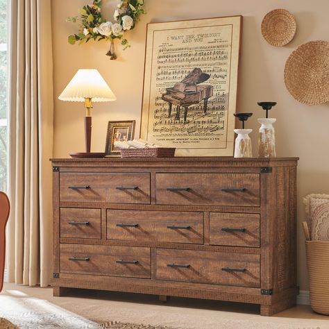 PRICES MAY VARY. Richly Rustic Aesthetic: This large 7 drawer dresser’s crisp, clean and quaint profile is enriched with a striking weathered oak grain with distressed finish and thick plank styling for that much more rustic warmth. Antiqued nailhead trim and handle pay homage to country farmhouse, making for a chic look loaded with charm, eamlessly complementing any furniture and decor style. Multi-Storage Purpose: Measuring L54"*W15.5"*H31.25". This long dressers for bedroom boasts an immense Tall Dresser Decor, Light Wood Dresser, Rustic Closet, Closet Dresser, Western Bedroom Decor, Dresser In Closet, Large Chest Of Drawers, Rustic Vintage Decor, Bedroom Large