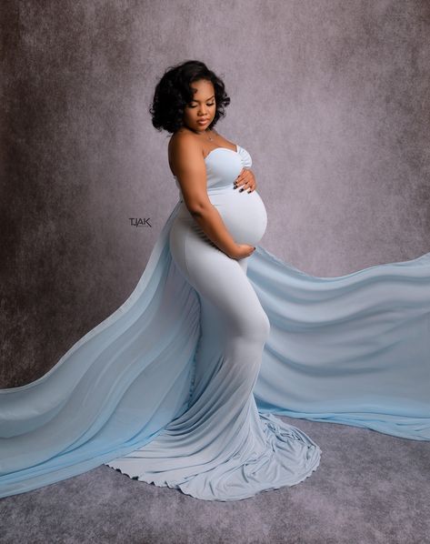 Studio maternity photoshoot of pregnant woman wearing a blue dress with long train by TjakPhotos in Laurel MD. Photoshoot Ideas For Pregnant Women, Maternity Hairstyles Black Women, Blue Maternity Dress Photo Shoot, Pregnancy Shoot Dress, Blue Maternity Shoot, Pregnant Photoshoot Black Women, Pregnant Photoshoot Ideas, Maternity Shoot Black Women, Family Pregnancy Photoshoot