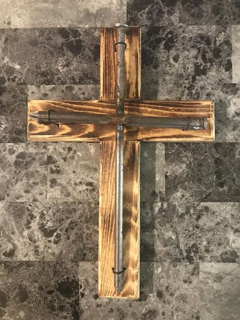 Handmade in the foothills of Eastern Kentucky, this one of a kind cross is a Robinson Crafting custom creation.  This rustic nail cross features a 12 inch spike and two 8 inch spikes welded together and attached to a wood cross made from hand selected pine. Includes hanging ring on back. Measures 13 inches tall by 9 inches wide and approx 2 inches thick. Finished with a torch for an extremely rustic look. This unique technique highlights the grain of the wood while leaving an aged appearance. Th Rustic Towel Rack, Diy Wood Pallet Projects, Nail Cross, Eastern Kentucky, Pastor Appreciation, Church Gifts, Pastors Appreciation, Wooden Crosses, Cross Christian