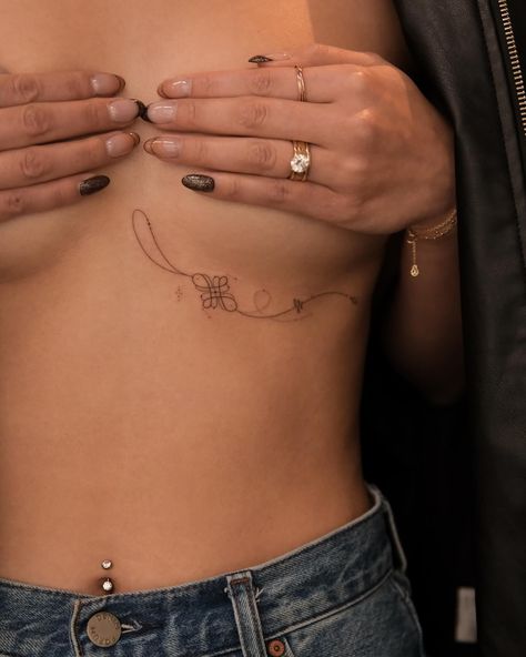 This tattoo features the Tibetan Endless Knot, a sacred symbol in Buddhism representing interconnectedness, eternity, and the cyclical nature of life and existence. The knot flows elegantly with fine lines and is adorned with delicate tassels, adding a sense of movement and grace to the design. The overall composition reflects harmony and balance, symbolizing the unity of wisdom and compassion. #handpoke #sonyapokesyou #endlessknottattoo #sanfranciscotattoo Life Path Number 2, Eternity Tattoo, Buddhism Tattoo, Life Path Number 7, San Francisco Tattoo, Tibetan Tattoo, Balance Tattoo, Sanskrit Tattoo, Endless Knot