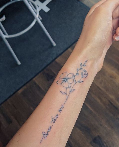 Tattoo With Writing And Flowers, Quote In Flower Tattoo, See The Good Tattoo With Flower, Flower Stem Quote Tattoo, Simple Flower Tattoo With Words, Flower Stem Into Words Tattoo, Flower Tattoo Words As Stem, Writing Tattoos With Flowers, Cursive Tattoo With Flower