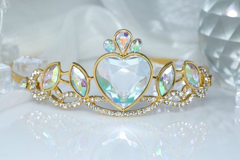 ♚Crown Design♚ The tiara has a large heart-shaped acrylic diamond and 4 acrylic diamonds in the middle, surrounded by clear rhinestones. This is the perfect set to create a fairytale crown for your princess. ♚Material♚ Zinc alloy, AB color acrylic diamond, rhinestone. ♚Headpiece Size♚ Tiara size: about 6 inches long; 5 inches wide; 2 inches high (15cm*13*5cm), the size of the headpiece fits most people's heads. ♚Wide Occasions♚ The sparkling rhinestone crown is perfect for any party, adding joy to your party and ensuring you catch everyone's attention. ♚COMFORTABLE TO WEAR♚ This crown is just like a regular headband, with no hair comb at the end, giving you maximum comfort! Crowns Princesses, Repuzel Crown, Purple Tiaras And Crowns, Purple And Gold Tiara, Quince Crowns Gold And Purple, Rapunzel Tiara, Purple Princess Crown, Fairytale Crown, Princess Items