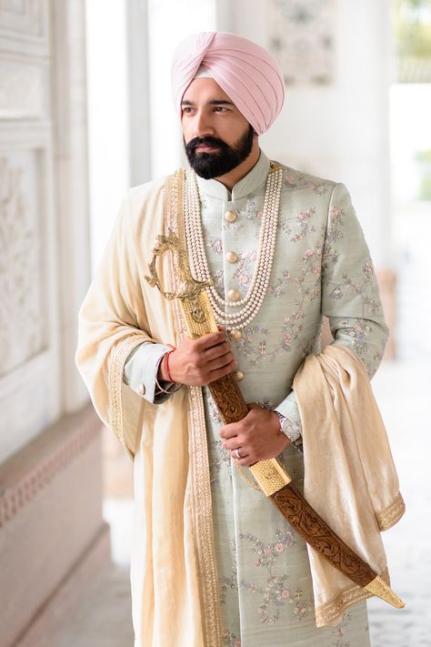 Here's real groom Raj wearing his soft mint green sherwani on his wedding day at Gravesend Gurdwara. His pink turban from Bespoke Turbans (UK) adds to the contemporary look. Best Wedding Sherwani For Groom, Achkan For Men Indian Weddings Punjabi, Mens Wedding Sherwani Indian, Pastel Green Sherwani Groom, Mint Green Sherwani, Dulha Sherwani Wedding For Men, Sikh Groom Outfit, Pink Sherwani For Groom, Hindu Wedding Outfit