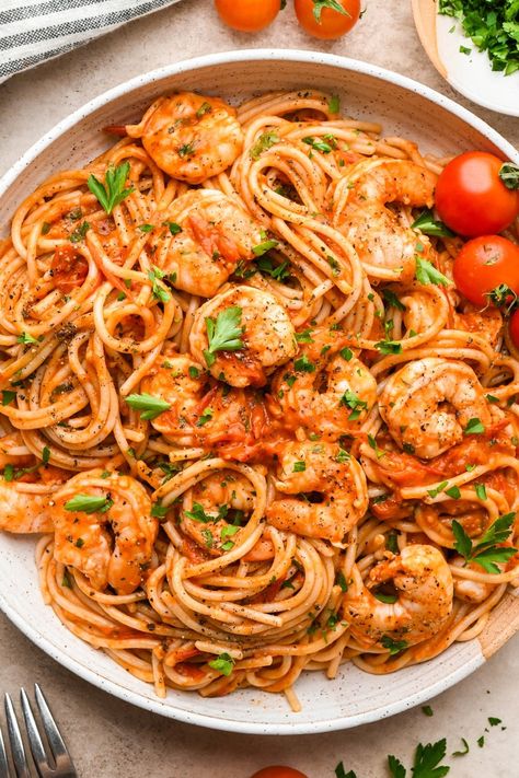 This simple burst cherry tomato and shrimp pasta is so simple but so incredibly flavorful! Made with fresh cherry tomatoes, lots of garlic, and a little bit of tomato paste to bolster the tomato flavor, it is made without cream and dairy free. We opt for GF pasta to keep the recipe gluten free, but any pasta you like will work! It is all cooked in one skillet and ready in just 30 minutes. Adding chopped parsley brings some color and elegance to the dish, making it just as perfect for serving guests as it is for a quick weeknight dinner. Tomatoe Shrimp Pasta Recipes, Shrimp Cherry Tomato Pasta, Pasta Sauce With Cherry Tomatoes, Blistered Cherry Tomatoes Pasta, Shrimp Tomatoes Pasta, Shrimp And Tomato Pasta, Grape Tomato Recipes Pasta, Shrimp Sun Dried Tomato Pasta, Pasta Recipes With Cherry Tomatoes