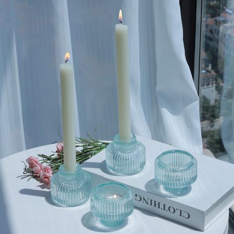 PRICES MAY VARY. [Soft Blue Color & Vintage Design]: Tapered candlestick holders with a light tint of blue, the clean & dreamy color perfect for beach wedding/summer entertaining indoors and outdoors. The optical & ribbed glass design adds a touch of vintage and romantic to any table centerpiece [Versatile Taper Candle Holders]: Reversible candle stick holder set of 4 not only fit taper candles snugly, but also accommodate tea lights/votives perfectly, which are a beautiful addition to wedding p Colorful Candle Sticks, Light Blue Apartment, Blue Apartment Decor, Candles On Table, Candle Stick Holders Decor, Apartment Rooms, College Rooms, Coastal Table Decor, Apartment Finds