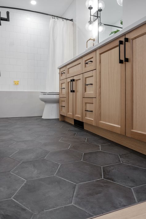 Master Bath Dark Floor Tile, White Oak Bathroom Vanity Black Floor, Textured Bathroom Floor, Galley Kitchen Floor Tile, Bathroom Vanity And Floor Ideas, Black Floor Restroom, Black White Gray Wood Bathroom, Bathroom And Kitchen Tile Floor, Guest Bathroom Tile Ideas Floor