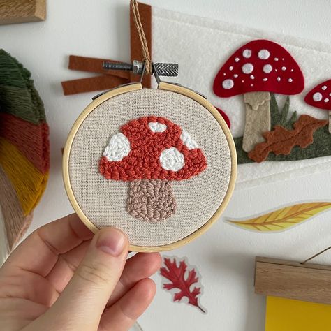 3 inch punch needle mushroom embroidered hoop. This decoration is perfect for a baby shower gift to show off in their nursery, an announcement, a birthday.. a great hanging on a wall with just one nail. Or simply lean on a shelf. Due to the nature of this item, there will be slight variations as it is handmade but will always be similar to image shown. Embroidery Nursery Wall Decor, Punch Needle Nursery Decor, Mushroom Nursery Decor, Mushroom Baby Nursery, Mushroom Nursery, Room Embroidery, Mushroom Wall Decor, Nursery Embroidery, Enchanted Forest Baby Shower