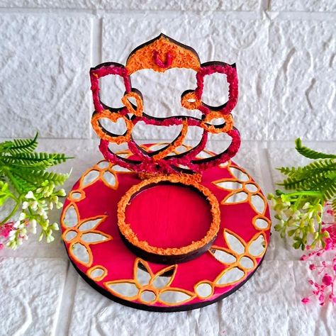 Welcome Lord Ganesha with a warm glow! DIY Tissue Texture Art Tea Light Holder for Ganesh Chaturthi 🙏 Material Required 👇 -MDF Base -Tissue -Wall Putty -Maroon and Yellow Color -Mirrors -3D Outliner -Fevicol Dm for Order 📦 ☺️ . . . . #ganeshchaturthi #ganeshtealightholders #homedecor #hobbyideasindia #tealightholder #tissuetextureart #textureart #festivalvibes #ganeshchaturthi2024 #KraftyKinni [Ganesh chaturthi, Tea light holder, Ganesha tea light holder, Festival decor, Home decor, ... Light Holder Diy, Tea Light Holder Diy, Ganesh Decoration, Diya Decoration, Fineliner Art, Diy Diwali Decorations, Festival Decor, Diwali Craft, Book Page Art