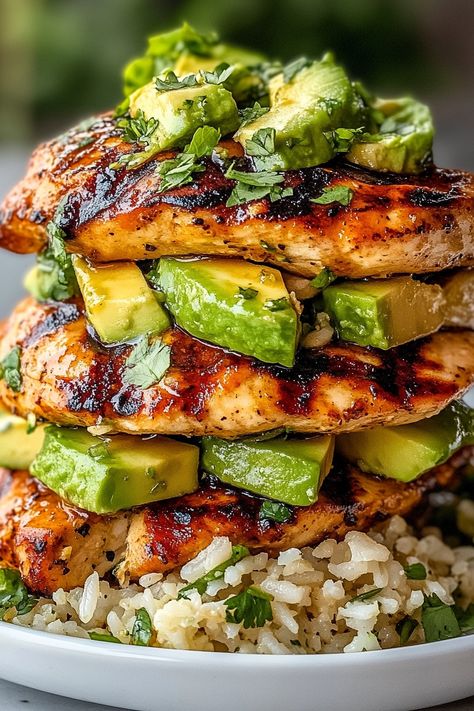 If you’re looking for a fresh and vibrant dish that’s perfect for summer, then this Honey Lime Chicken & Avocado Rice Stack is just what you need! This delightful meal features tender, marinated chicken layered with creamy avocado and fluffy rice, all drizzled with a zesty honey-lime dressing. It’s a wholesome and satisfying dish that’s not only delicious but also visually stunning! What makes this dish so special is the harmonious combination of flavors and textures. The sweet and tangy honey- Honey Lime Chicken Rice Stack, Light Healthy Chicken Recipes, Honey Lime Chicken And Avocado Rice, Honey Lime Chicken Avocado Rice Stack, Dinner Ideas Avocado, Meals With Avocado Dinners, Lime Dinner Recipes, Chicken And Rice Healthy Clean Eating, Avocado Meal Prep