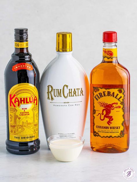 Made with Rumchata, Kahlua, and Fireball, this Cinnamon Roll Cocktail has all of the best flavors of the holiday season in one drink. Decadent, creamy, and so festive! Make one for yourself or a whole pitcher for a party. Rum Chata Fireball Shots, Creamy Fireball Drinks, Fireball Rumchata Shots, Rum Chata Fireball Drink Recipes, Horchata Rum Cocktails, Fireball Rumchata Drink, Rum Chats And Fireball, Rumchata And Fireball Recipes, Rumchata Fireball Drinks