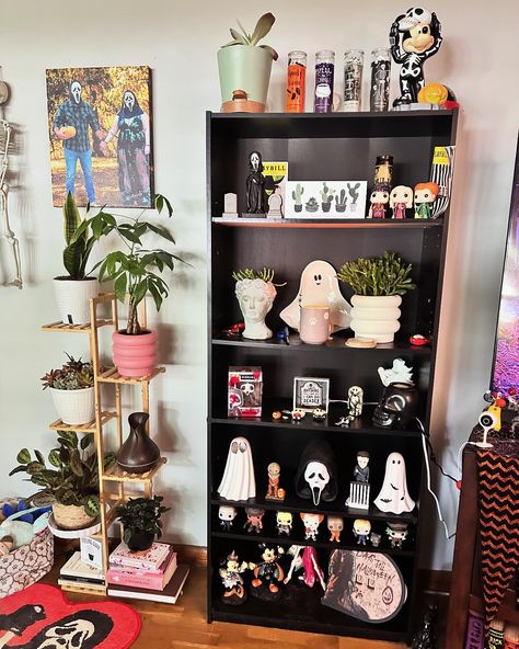 My favorite little spot in our movie room 💕 my horror shelf and my plant shelf. 🦴🪴 if only I had more 😂 Cube Shelf Decor Aesthetic, Horror Shelf, Horror Living Room, Artistic Bedroom, Horror Room, Nerd Cave, Artist Bedroom, My Plant, Dark Home Decor