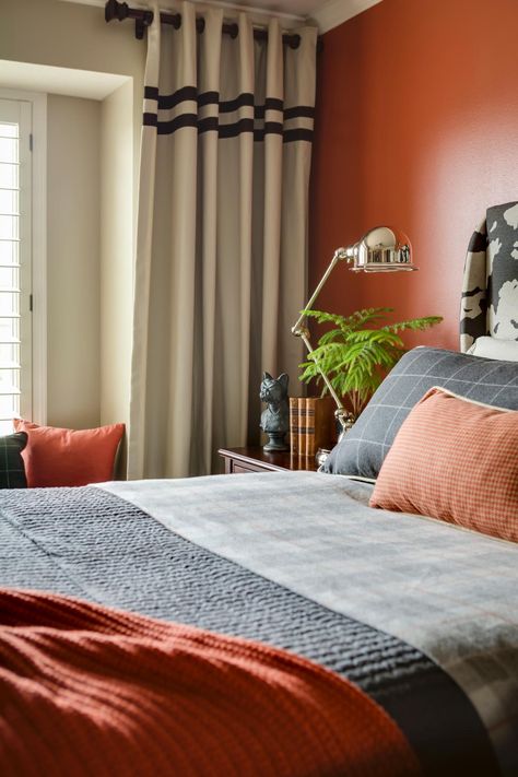 A sophisticated masculine feel is created in this bedroom by tastefully mixing menswear patterns like houndstooth and plaid and using a crisp yet warm color palette of gray, orange and black. Australian Renovation, Nature Inspired Bedroom, Orange Bedroom, Masculine Bedroom, Transitional Bedroom, Bedroom Orange, Classic Bedroom, Boys Bedroom Decor