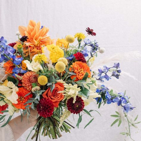 a fun fall bridal bouquet featuring bright colors and many native Mexican flowers. These include marigolds, dahlias, zinnias, passion flower vine, chocolate cosmos, and more. Passion Flower Vine, Flower Making Crafts, Marigold Wedding, Native Mexican, Fall Bridal Bouquet, Dahlias Wedding, Chocolate Cosmos, Bright Wedding Flowers, Mexican Flowers