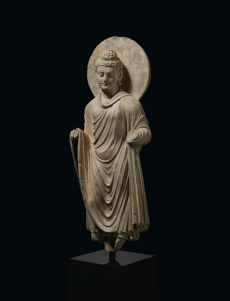 A GRAY SCHIST FIGURE OF BUDDHA SHAKYAMUNI, ANCIENT REGION OF GANDHARA, 3RD-4TH CENTURY CE | Christie's Gandhara Art, Historical Sculptures, Standing Buddha, Buddha Garden, Buddha Figures, Mahayana Buddhism, Buddha Sculpture, Egypt Art, Plastic Art