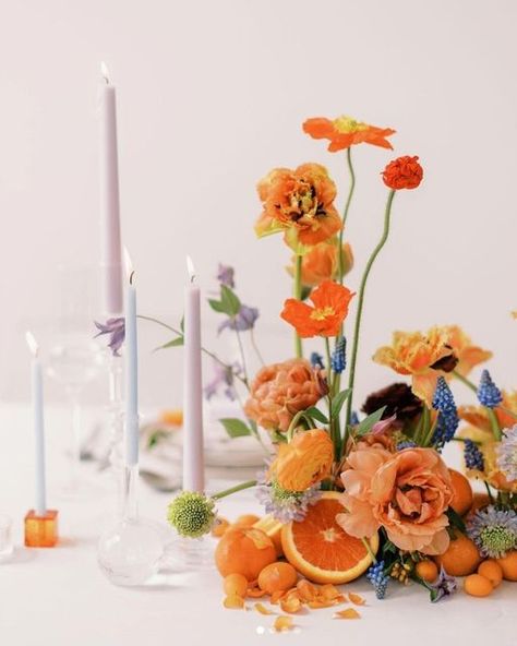 Fruit In Centerpieces, Fruit And Flower Table Decor, Persimmon Wedding Colors, Orange Floral Tablescape, Orange Citrus Wedding Decor, Modern Citrus Wedding, Fruit And Flower Wedding Centerpieces, Citrus And Flowers, Bright Wedding Table Settings