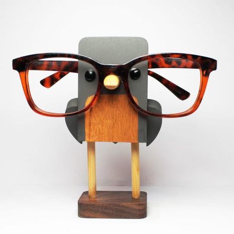 Eyeglass Stands that combine both art and function. Browse our current eyeglass displays, or we can customize your orders to create memorable and meaning gifts. Eyeglass Stand, Mini Mart, Baltimore Oriole, Eyeglass Accessories, Bird Stand, Glasses Holder, Robin Bird, Wood Project, Eyeglass Holder