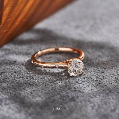 We are over the moon to introduce this stunning 18k rose gold constellation-themed diamond engagement ring that we created for a special customer. This ring features a brilliant round diamond in the center, representing the brightest star in the sky. The diamond is surrounded by smaller diamonds, forming a constellation of sparkling stars. The 18k rose gold band adds a warm and romantic touch to this celestial-inspired piece. Brightest Star In The Sky, We Are Over The Moon, Star In The Sky, Sparkling Stars, Rose Gold Band, Star Sky, Bright Stars, Over The Moon, Gold Band