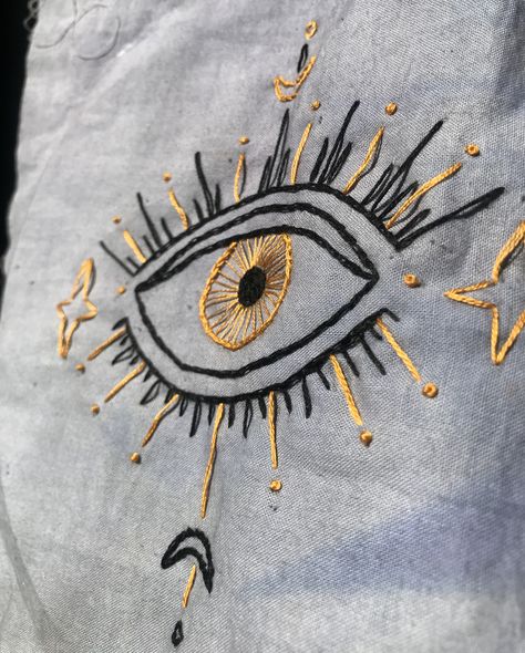 Eyes Embroidery Design, Evil Eye Embroidery Design On Shirt, Eye Fashion Clothes, Cool Hand Embroidery, Third Eye Embroidery, Eye Embroidery Pattern, Embroidery Evil Eye, Evil Eye Embroidery Design, Button Down Shirt Aesthetic