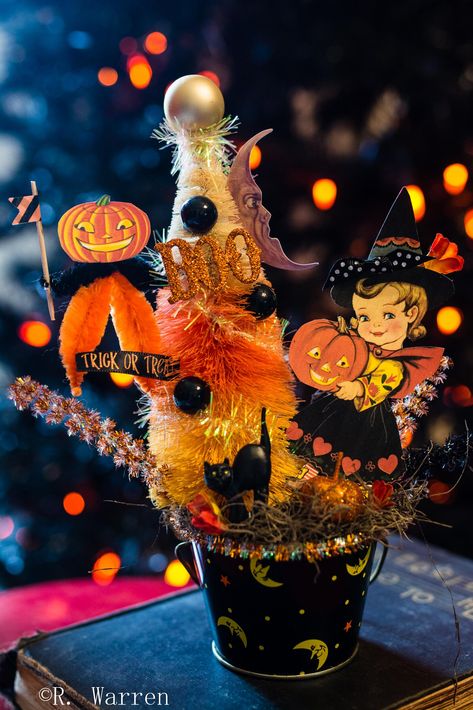 This is a one of a kind, vintage, Halloween assemblage. Made in a vintage Halloween tin stuffed full of fun fall goodies... Vintage Halloween cupcake pics, hand dyed bottle brush tree, repro vintage graphics, and tinsel. Stands approx. 9x7 inches tall. Original and Unique. Halloween Assemblage, Cupcake Pics, Retro Halloween Decorations, Halloween Vignette, Fall Goodies, Happy Halloweenie, Cupcake Pictures, Halloween Iii, Halloween Cupcake