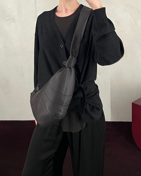 The anthracite twisted cardigan and dark chocolate medium croissant bag by Lemaire styled with Rick Owens' dark dust rib tank, Jaga black meloni pants and Guidi black 992 classic derby.⁠ ⁠ New arrivals are available in-store now and online soon. Lemaire Croissant Bag, Croissant Bag, Visual Design, Croissant, Rick Owens, Dark Chocolate, Derby, New Arrivals, In Store