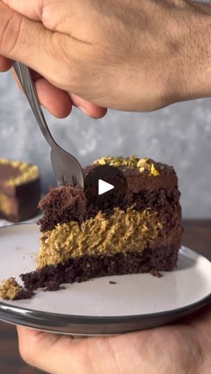 This chocolate pistachio cake is inspired by the viral Dubai chocolate bar. It features 2 moist chocolate cake layers, an amazing filling with a homemade white chocolate and pistachio cream mixed with crunchy kataifi pastry, and a whipped chocolate ganache frosting. It's one of the best desserts you'll ever have!
https://www.thehungrybites.com/chocolate-pistachio-cake/ | The Hungry Bites Dubai Chocolate Cake, Chocolate Pistachio Cake, White Chocolate And Pistachio, Dubai Cake, Chocolate Bar Cakes, Chocolate Cake Layers, Kataifi Pastry, Homemade White Chocolate, Dubai Chocolate