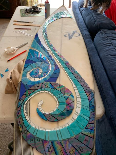 Stained glass mosaic of waves and sunshine still to come