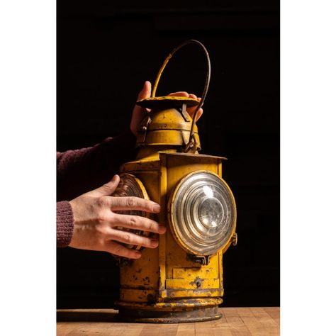 c. 1900s; The Handlan-Buck Co. - St. Louis  Antique painted cast iron kerosene railroad lantern with fresnel lenses.  This piece was manufactured by Handlan-Buck, a prominent manufacturer of railroad lamps and lanterns that operated from the 1850s until the 1970s. The company was both highly respected and patronized by railroad companies, with strong sales in its home region of the Midwest. As evidenced by an embossed ownership tag, this particular lamp was used on the Chesapeake and Ohio Railway, a train line that ran from its westernmost points in Chicago and Michigan eastward to Virginia, New York, and Delaware. Featured on this lamp are two heavy-duty glass fresnel lenses and chippy coat of traffic yellow paint. Mining Lantern, Railroad Lanterns, Pagoda Lanterns, Antique Lanterns, Railroad Companies, Copper Lantern, Wall Lanterns, Yellow Paint, Chippy Paint