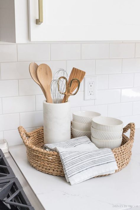 The perfect set-up for next to your range! A round woven tray holds most-used utensils in a pretty marble holder, a hand towel, and white patterned bowls! #kitchen #kitchens #kitchenrenovation #kitchenreno #kitchenremodel #kitchendesign #kitchenideas Interior Design Country, Woven Trays, Driven By Decor, Gray And White Kitchen, White Kitchen Remodeling, Decor Minimalist, Counter Top, Küchen Design, Kitchen Styling