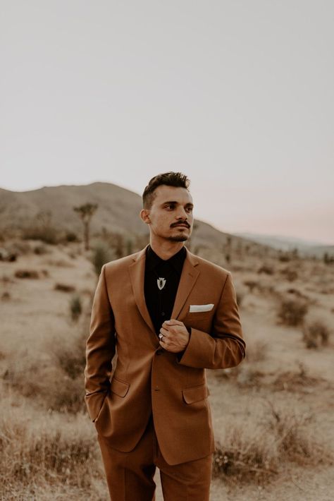 This Desert Elopement in Joshua Tree, gave me all the desert boho dreams! The brides, Dreamers and Lovers lace wedding dress went perfectly with the dried floras, desert backdrop and the grooms burnt orange wedding suit. Desert Elopement / National Park Elopement / Bolo tie for groom / Sunset Bridal Portraits / Boho Wedding Ideas. Browse the blog to see more of this stunning Desert Elopement. Click to Inquire with me on my website, for your Southern California wedding or elopement! Alyssa Mariee Burnt Orange Tuxedo Wedding, Burnt Orange Tuxedo, Burnt Orange Suit, Fall Groomsmen, Dnd Outfits, Suit For Groom, Desert Backdrop, Homecoming 2022, Sedona Elopement