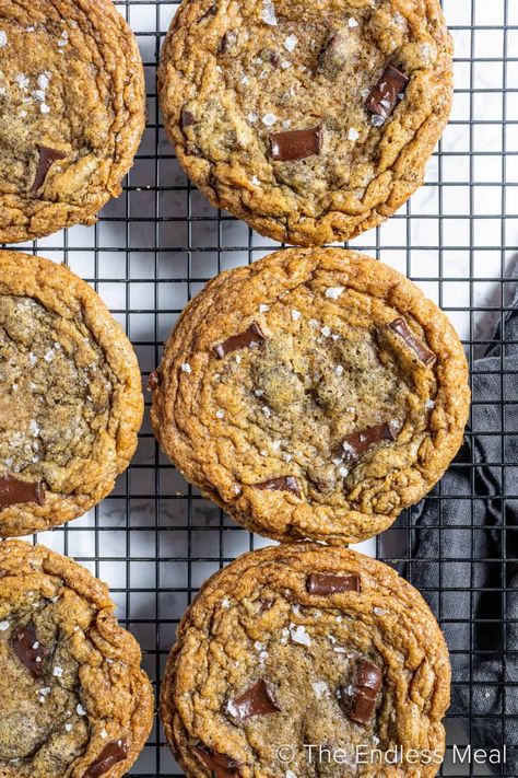 These brown butter sea salt chocolate chip cookies are worth hiding from the kids! Ok, or at least make a double batch so there's more than enough to go around. The crisp edges and buttery soft centers are what dreams cravings are made of. #theendlessmeal #cookies #brownbutter #chocolatechip #chocolate #dessert #chocolatedessert #holidaycookies #christmascookies #chocolatechipcookies #brownbuttercookies Salt Cookies Recipe, Sea Salt Chocolate Chip Cookies, Salt Chocolate Chip Cookies, Buttery Chocolate Chip Cookies, Salted Chocolate Chip Cookies, Brown Butter Cookies, Brown Butter Chocolate Chip Cookies, Caramel Chocolate Chip Cookies, Sea Salt Chocolate