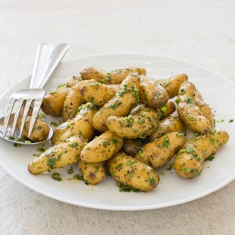 Slow-Cooker Lemon-Herb Fingerling Potatoes | America's Test Kitchen Parchment Paper Recipes, Slow Cooker Potatoes, Donut Toppings, Recipes Vegetables, Cookie Toppings, Olive Oil Garlic, America's Test Kitchen Recipes, Fingerling Potatoes, Lemon Herb