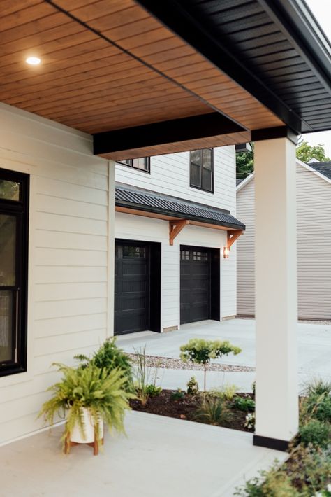 Brick And Hardy Plank Exterior Modern, Pine Porch Ceiling, Elevated Patio, Addition Exterior, Lakehouse Exterior, 1900 Farmhouse, Nana Wall, Black Garage Doors, Black Garage