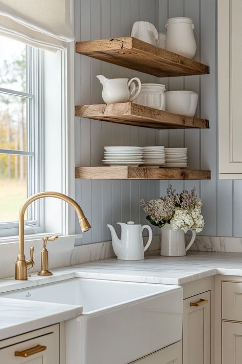 Discover the charm of the latest kitchen designs with this modern farmhouse look. Elegant open shelving complements the sleek brass fixtures for a timeless style. Perfect blend of rustic and contemporary! #HomeDecor #KitchenInspiration #ModernFarmhouse Minimalist Cottagecore Kitchen, Farmhouse Kitchen Open Shelving Ideas, Rustic Kitchen Design Inspiration, Kitchen Cabinets Open Shelves, Summerhouse Kitchen, Kitchen With Open Shelving And Cabinets, Farmhouse Open Shelving, Modern Victorian Kitchen, Open Shelves Kitchen