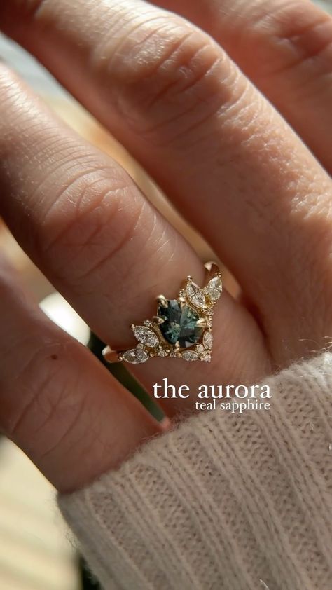 The Aurora 0.88 CT Pear Cut Teal Sapphire Ring✨ Should I do more Aurora rings?🧚‍♂️ #sapphire #fairyring #fantasyjewelry #engagementring… | Instagram Aurora Engagement Ring, Teal Sapphire Engagement Rings, Winter Engagement Ring, Teal Wedding Ring, Faerie Engagement Ring, Blue Engagement Ring Sapphire, Elven Engagement Ring, Engagement Rings Fairy, Unique Pear Engagement Ring