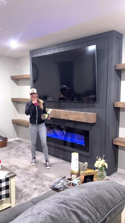 M E L I S S A 🌵 on TikTok Entertainment Wall With Floating Shelves, Ikea Entertainment Center With Fireplace, Entertainment Wall Ideas With Fireplace, Media Wall Plans, Floating Shelves Fireplace Surround, Entertainment Center Ideas With Fire, Diy Entertainment Wall, Media Wall With Shelves, Electric Fireplace Decor Ideas