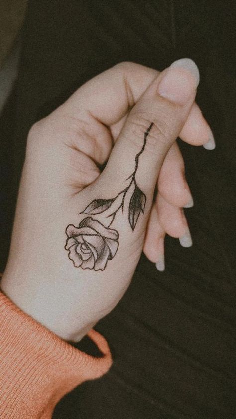 Rose Tattoo Designs Rose Tattoo Design On Hand, Roses Finger Tattoo, Female Rose Hand Tattoo, Rose Tattoo On Side Of Hand, Small Rose Hand Tattoo Woman, Small Rose Tattoo Finger, Rose On Thumb Tattoo, Rose Finger Tattoo For Women, Henna Tattoo Designs Rose