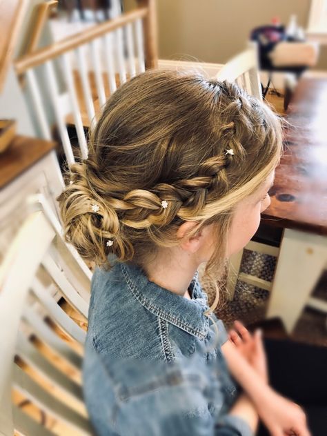 Beautiful low, messy bun updo with detailed side braid. Perfect updo for a bridesmaid or junior bridesmaid! Low Messy Bun Updo, Bridesmaid Low Bun, Junior Bridesmaid Hairstyles, Flower Girl Updo, Junior Bridesmaid Hair, Low Messy Bun, Low Bun Updo, Messy Bun Updo, Girls Updo