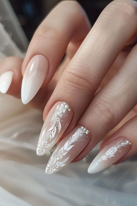 Discover over 60 stunning and sophisticated nail designs perfect for brides in 2024. Elevate your bridal look with these elegant ideas that will make your hands stand out on your special day. From classic French tips to intricate lace patterns, find the perfect inspiration for your wedding nails here. Whether you prefer a timeless and minimalistic style or something more ornate and glamorous, these designs cater to various tastes. Get ready to walk down the aisle with beautifully manicured nails Nails Special Ideas, Nails For Your Wedding Day, Nail For Bride Wedding, Bridal Nail Ideas French, Nail Design For Wedding The Bride, Wedding Nails Crome, Wedding Nails Lace Design, Nail For Wedding The Bride, Long Bride Nails