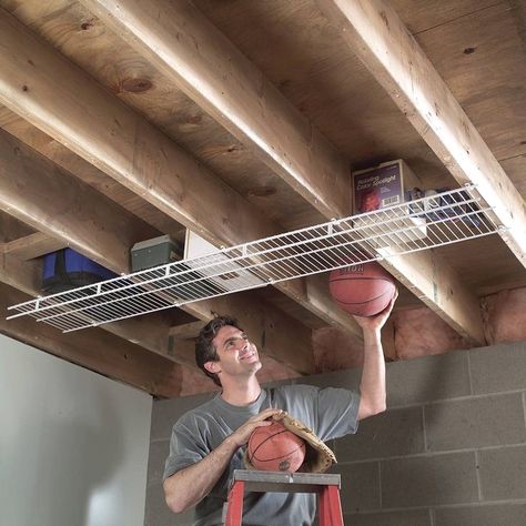 #organizer #organization #storageideas #storage Clever Storage Ideas, Plan Garage, Overhead Garage Storage, Fishing Rod Storage, Overhead Garage, Shed Organization, The Family Handyman, Basement Storage, Garage Storage Organization