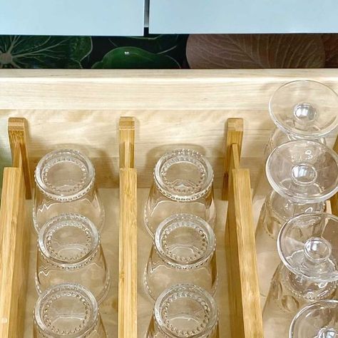 Amy Studebaker on Instagram: "How do you store your glassware?!?? This is one of my FAVORITE organizational hacks for storing and having easy access to glassware!! Any one of you can do this in your Kitchen! Nothing custom needed! My drawer is 30” wide and I store 42 glasses (each and every glass is easily accessible)! I’m not standing on tip toes looking through upper cabinets, I’m not digging behind particular styles of glassware to get to the “other” needed styles! I use bamboo spring loaded dividers and line the glasses up! They glasses don’t move or bump against each other at all! We have been using this method for two years and it has been a HUGE space saver as well as just easy access on a daily basis! @thecontainerstore . . . . . . #amystudebakerdesign #traditionaldesign #homedesi Glasses Drawer Organizer, Storing Glasses In Drawers, Glassware Drawer, Amy Studebaker, Washington House, Washington Houses, Organizational Hacks, Arizona House, Bar Glasses