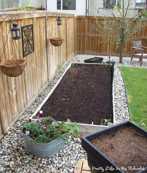 Stones around raised garden beds. Love this idea for a vegetable garden. Also great to bring garden bed forward, not directly on the fence line for more sun exposure. نباتات منزلية, Have Inspiration, Garden Yard Ideas, Garden Bed, Veggie Garden, Lawn And Garden, Raised Garden Beds, Shade Garden, Raised Garden