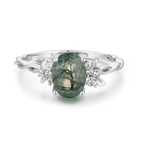 Magical, otherworldly, enchanting. Our Enchanted Garden Moss Agate Ring has earned its name with a stunning oval-cut moss agate center stone adorned with clusters of round white topaz gems in a twisted band. May this piece allow you to spread the seeds of happiness and cultivate a life you love.  *Please be informed that your moss agate patterns are naturally distinct and unique from the portrayed picture, and you will never witness the same pattern in two gems. It is one of a kind with a unique Twisted Band Ring, Magical Stones, Agate Engagement Ring, Moss Agate Ring, Gold Vermeil Jewelry, Green Rings, Twisted Band, Ring White Gold, Enchanted Garden