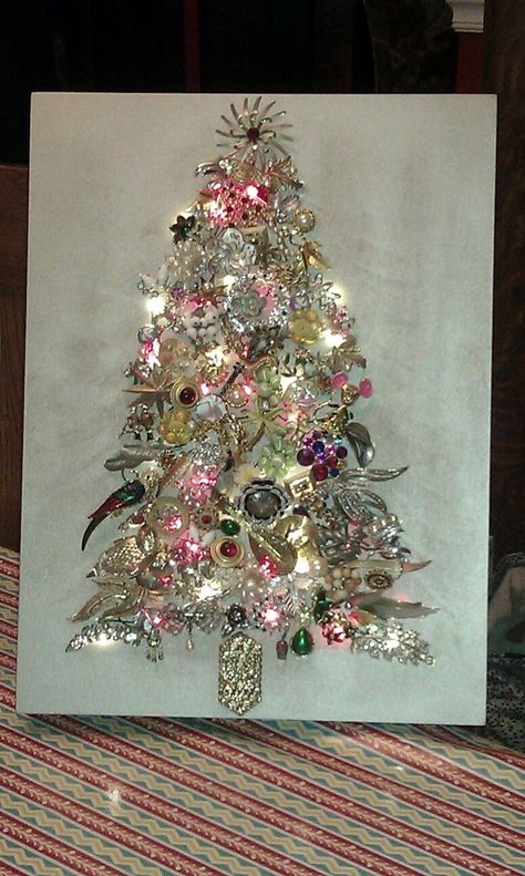 I finally made my jewelry tree out of a lot of my mother in law's and mother's old costume jewelry. Old Jewelry Crafts, Costume Jewelry Crafts, Jeweled Christmas Trees, Jewelry Frames, Vintage Jewelry Ideas, Jeweled Christmas, Jewelry Christmas Tree, Christmas Tree Art, Vintage Jewelry Crafts