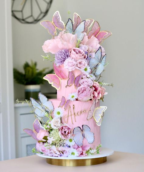 @cakes.by.estee shared a photo on Instagram: “Butterfly Dreams 🌸🦋🌸 I love cake and cupcake combos. Two tier floral butterfly cake with 24 matching cupcakes 🦋🌸🦋 Ballerina Pink…” • Jun 5, 2022 at 5:09pm UTC Floral Butterfly Cake, Butterfly Theme Cake, Birthday Cake Clip Art, Lotus Cake, Butterfly Wedding Cake, Butterfly Birthday Party Decorations, Flower Cake Design, Twin Birthday Cakes, Pink Buttercream