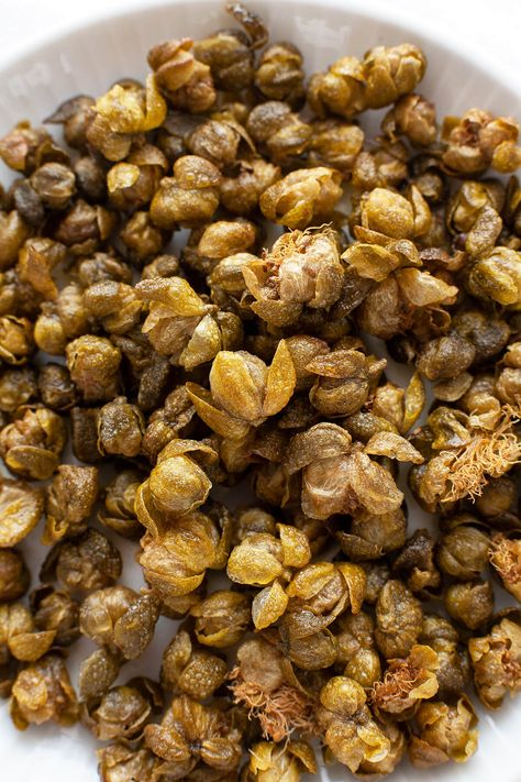 Crispy, nutty, and briny, Fried Capers are magical little flavor bombs that add an incredible dimension of flavor and texture to salads, pasta, meat, and vegetable dishes. #garnish #italian #recipe #easy #quick #flavor #fried #whatare #howtouse Crispy Capers, Sauteed Fish, Pasta Fish, Recipe Easy Quick, Caper Berries, Fried Capers, Capers Recipe, Food Planning, Salads Pasta