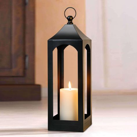 PRICES MAY VARY. Superior Quality Candle Lantern: Crafted with premium metal and a sleek black top ring, this lantern guarantees a safe and cozy atmosphere when lit with various types of candles. Versatile Design Candle Holder Lantern: Its simplistic style effortlessly blends with a variety of lighting and decor themes, making it suitable for both indoor and outdoor spaces such as yards, walls, pathways, driveways, shelves, tables, bars, patios, and porches. Convenient Hanging or Placement: The Floor Lanterns Decor Entryway, Floor Lanterns Decor, Outdoor Lanterns Patio, Front Porch Lanterns, Farmhouse Lantern Decor, Porch Lanterns, Floor Lanterns, Hanging Candle Lanterns, Farmhouse Lantern