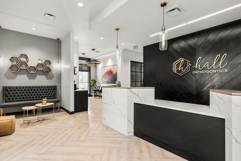 Black And Gold Dental Office, Dental Office Waiting Room Ideas, Beautiful Dental Offices, Office Foyer Design Entrance, Modern Farmhouse Dental Office, Chamber Of Commerce Logo Ideas, Dental Office Bathroom Ideas, Black And White Dental Office, Modern Doctors Office Waiting Rooms